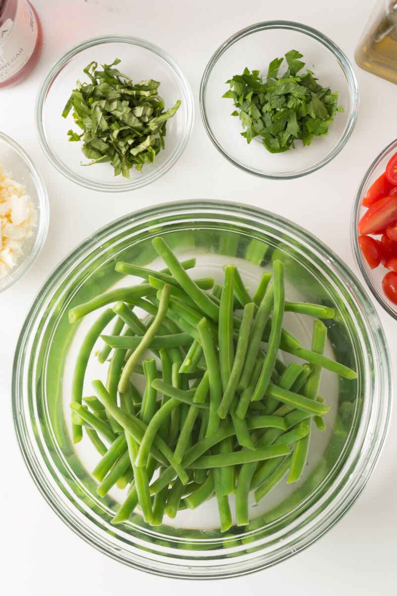 Fresh green beans with tomato and feta cheese combined with herbs and spices