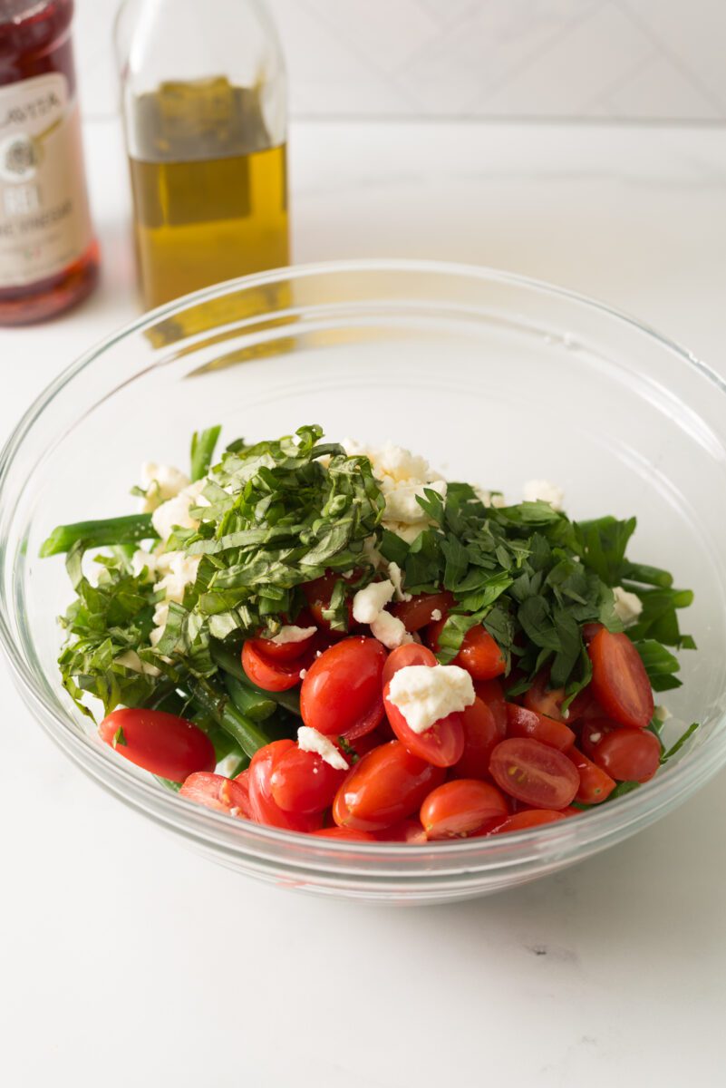 Fresh green beans with tomato and feta cheese combined with herbs and spices