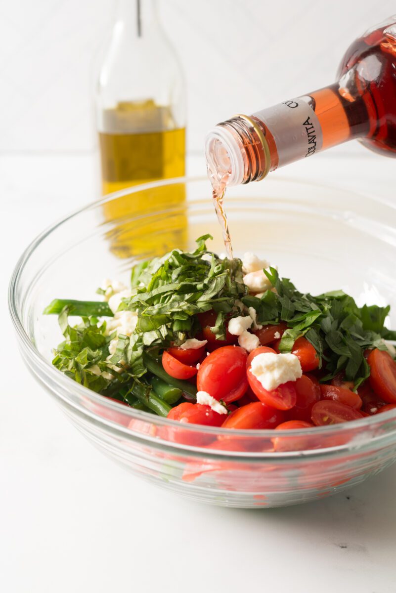 Fresh green beans with tomato and feta cheese combined with herbs and spices