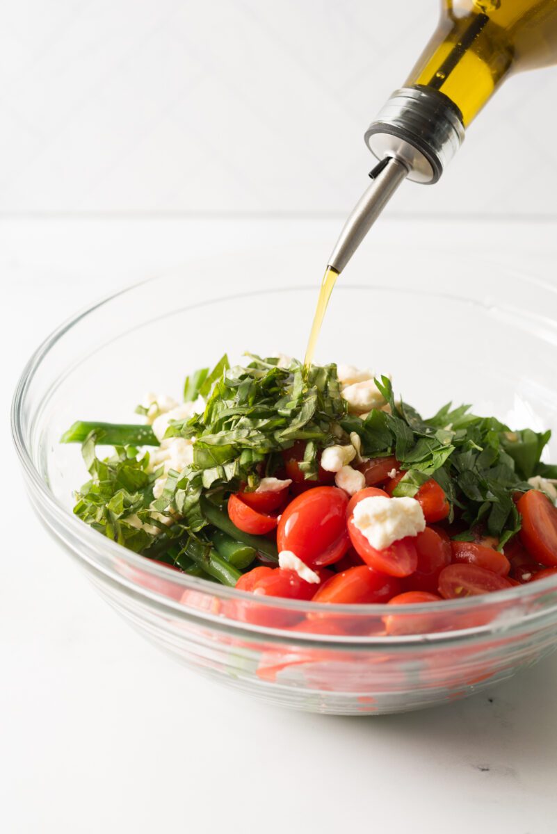 Fresh green beans with tomato and feta cheese combined with herbs and spices