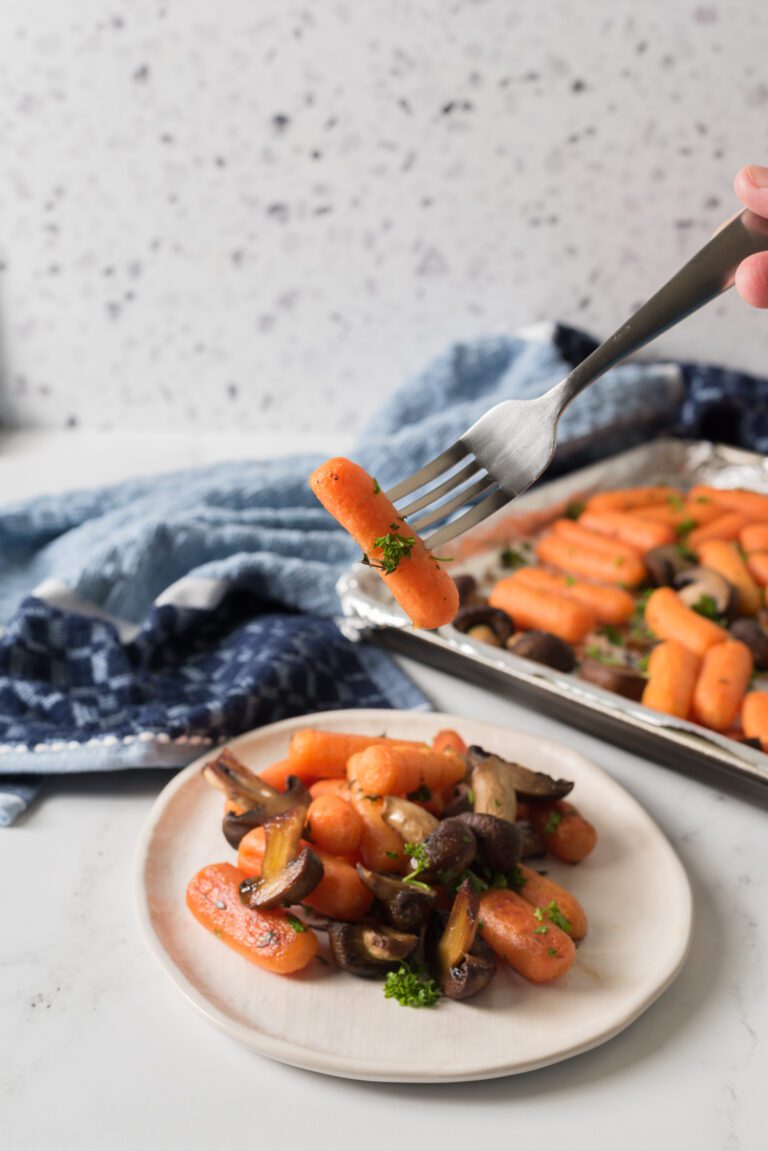 roasted carrots and mushrooms on a sheet pan