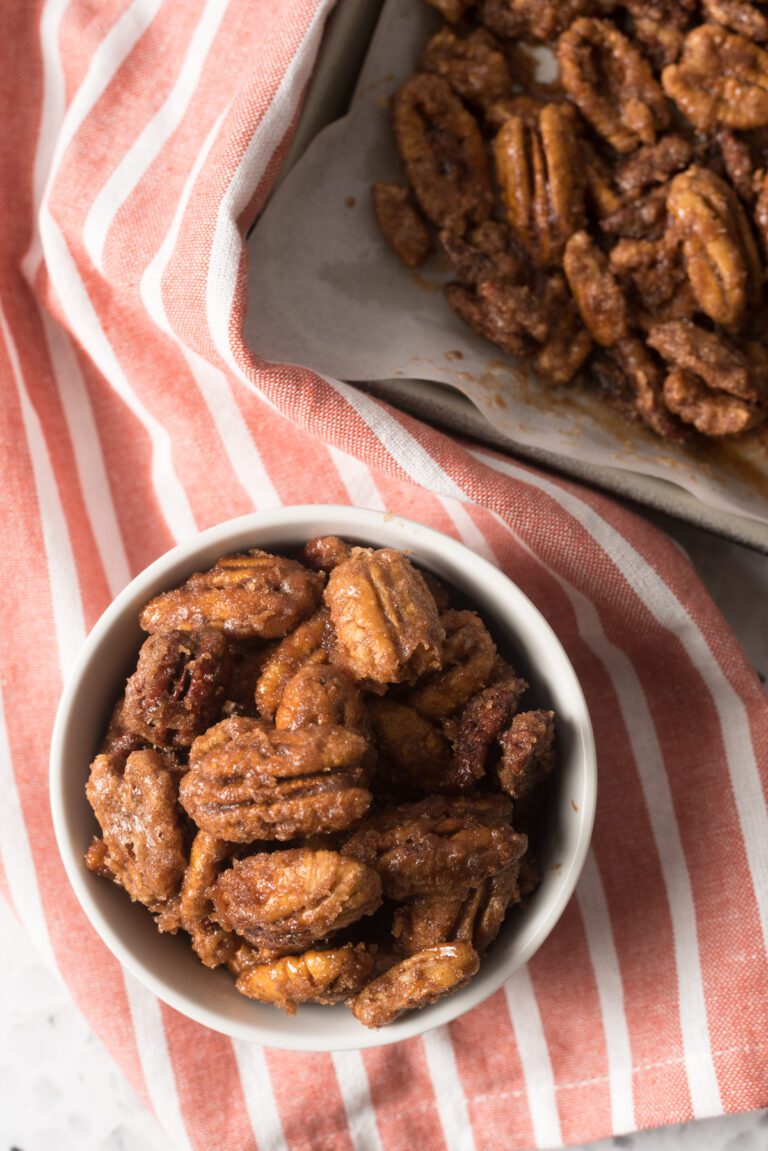 Pecans that have been evenly coated with sugar and cinnamon and baked in the oven like TikTok says to do!