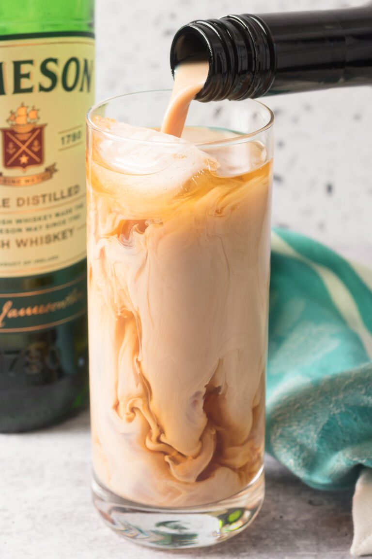 Jameson Whiskey and Bailey’s Irish Cream poured over a glass of ice.