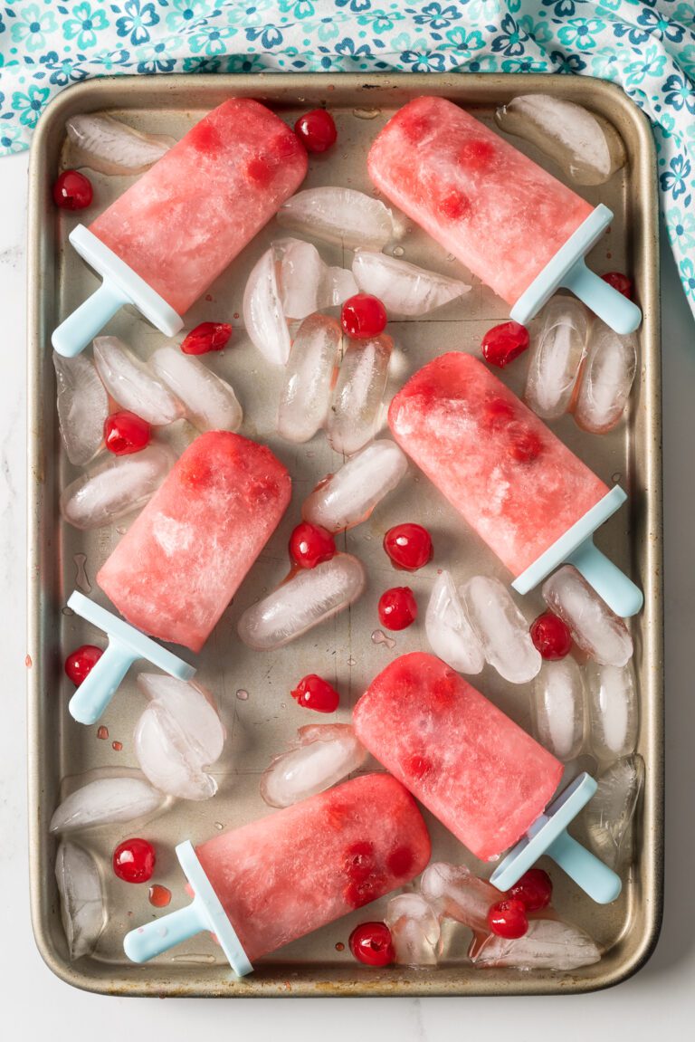 popsicles made with ginger soda, grenadine and cherries