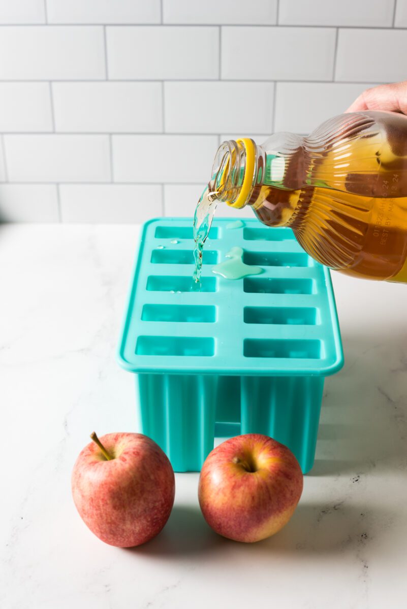 Homemade popsicles made out with apple juice.