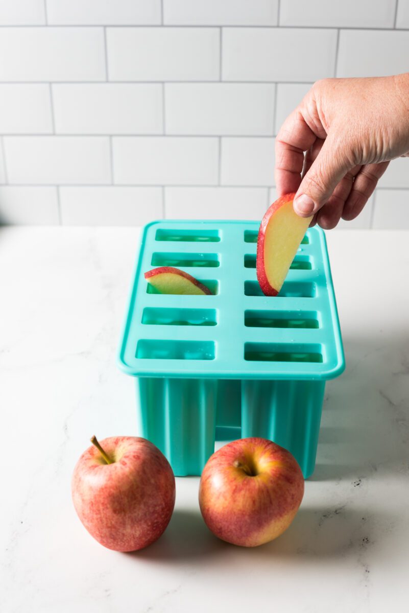 Homemade popsicles made out with apple juice.