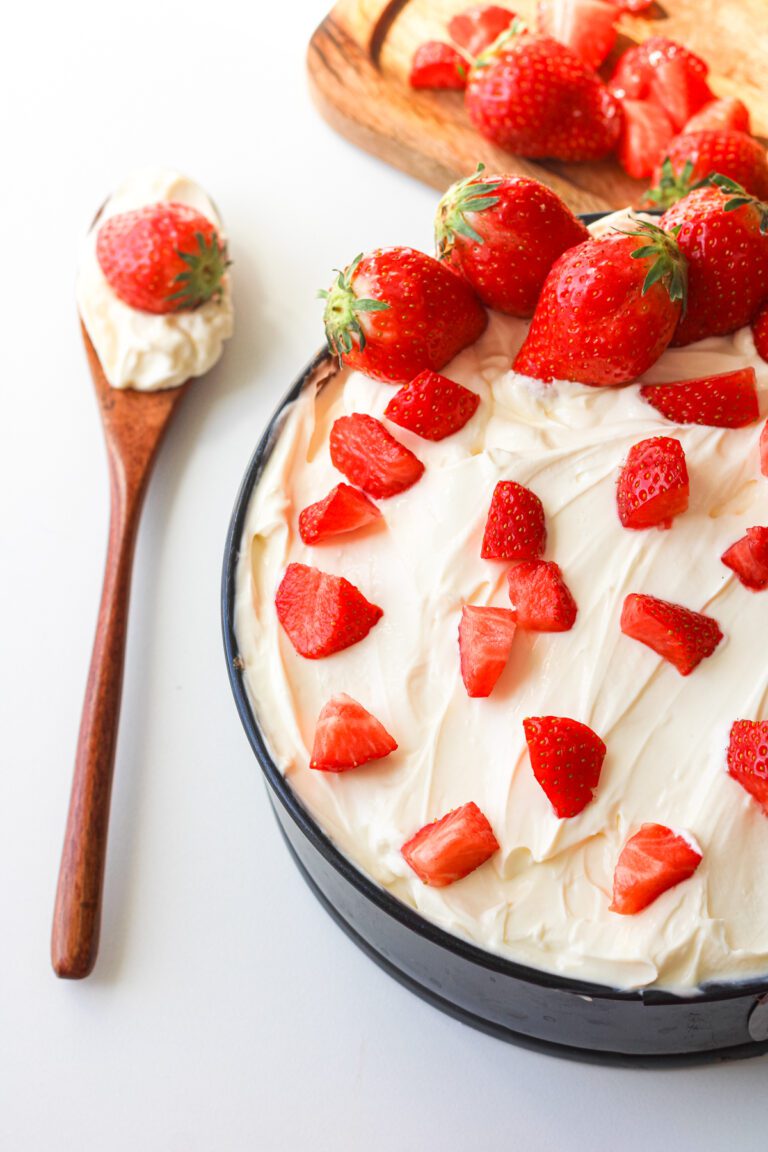 Poke cake made with vanilla cake mix and fresh strawberries