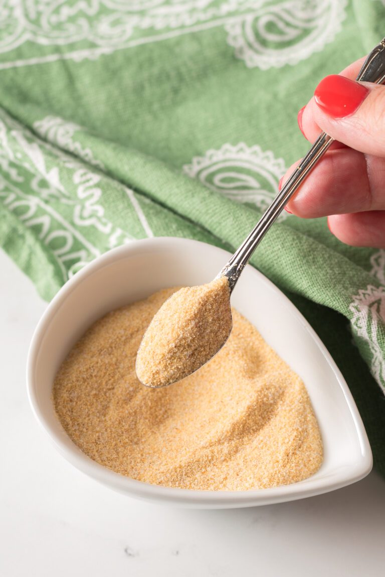 Funyun Seasoning in a small bowl with a spoon lifting som out of the bowl