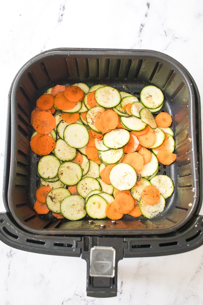 add in the zucchini and carrots, tossing again with olive oil, kosher salt and pepper