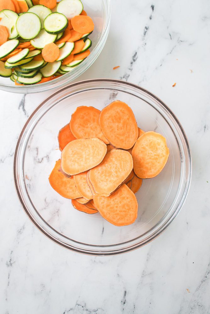 Place the sweet potato in the bottom of an air fryer in an even layer