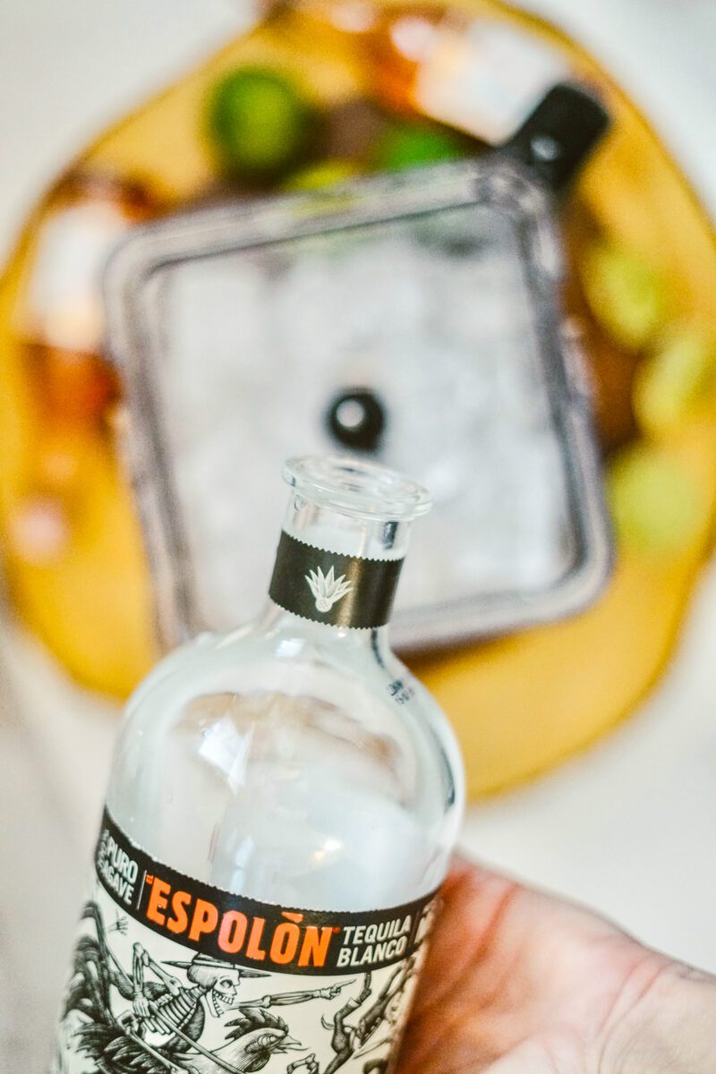 adding tequila with ice to blend