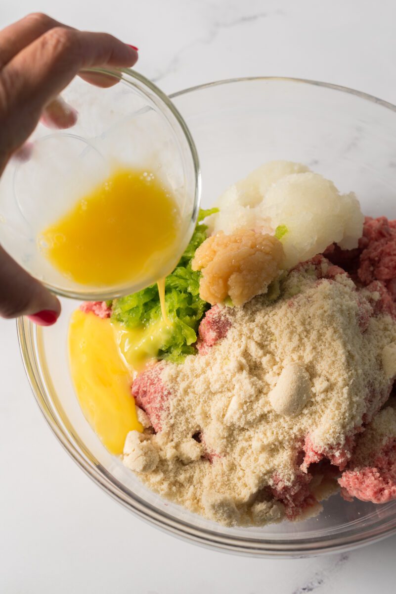 add egg, and garlic in a bowl