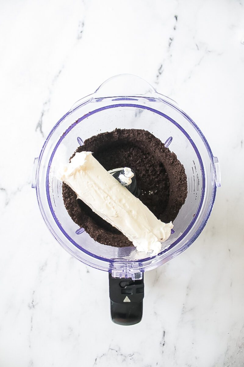 mixing cream with crushed oreo crumbs