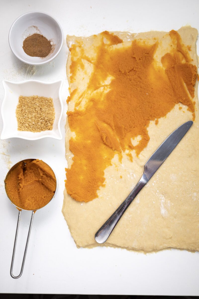 Spread pumpkin puree evenly onto the dough