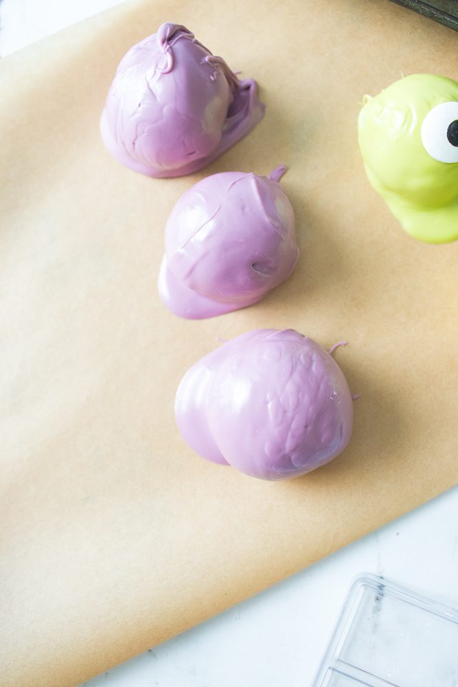 dip each one into the melted candy, ensuring it's fully coated