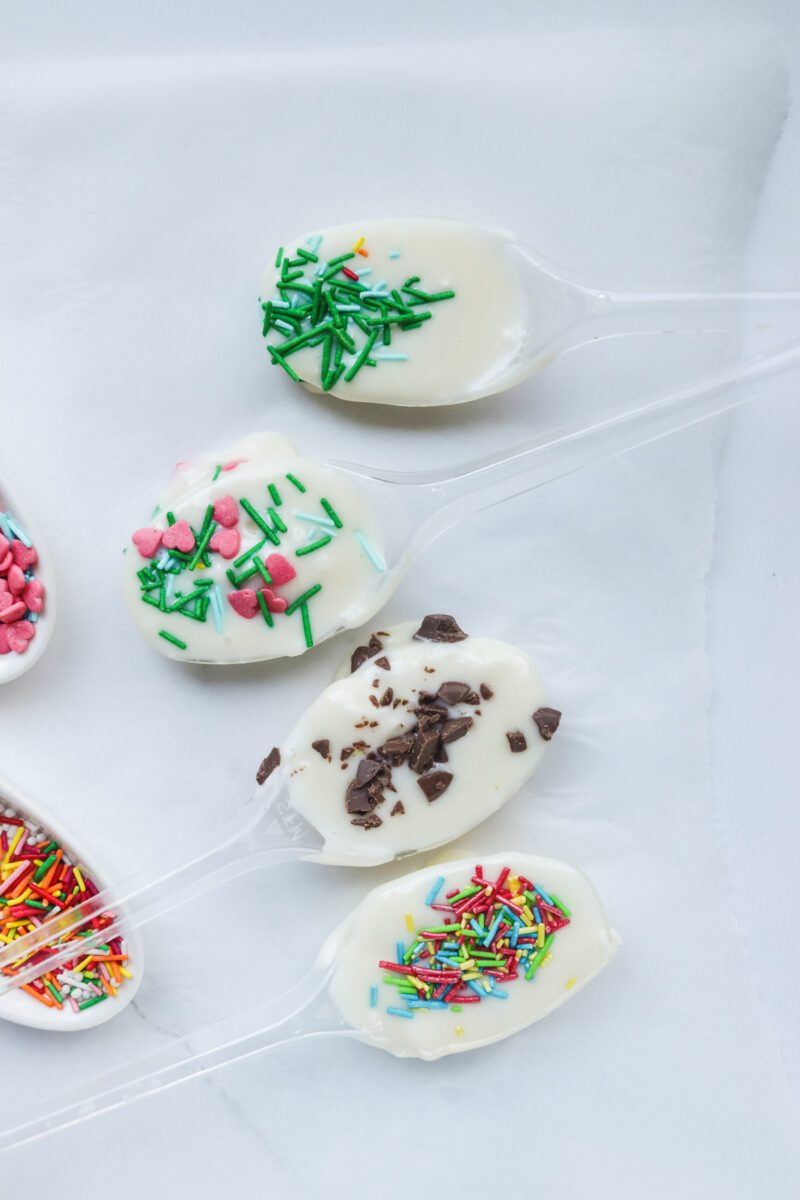 Dip the Spoon the in white chocolate and make a shape of a spoon and let it cool