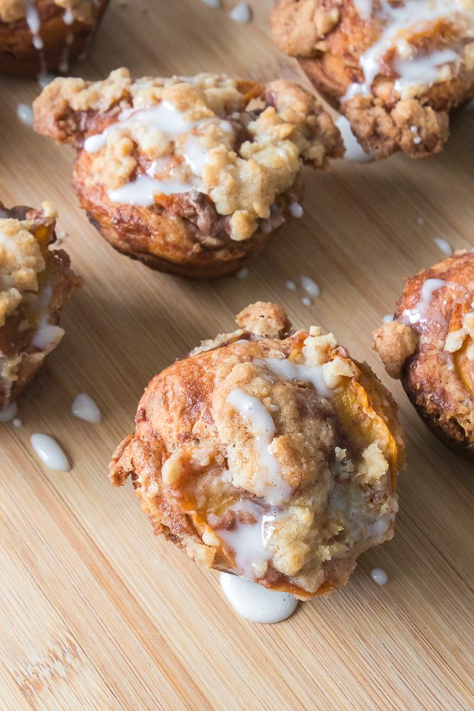 Easy cinnamon rolls made like peach cobbler in a muffin pan